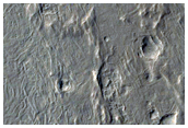Intersection of Curved Ridges with Mesa-Forming Material
