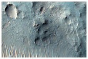 Small Tributary Deposit and Transverse Aeolian Ridges in Nirgal Vallis
