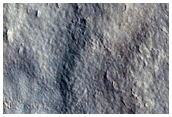 Moderately Degraded Crater on Northern Plains