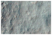 Valleys with Interior Sinuous Ridges in Terrain West of Novara Crater
