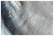 Dipping Layers in Crater in Northern Mid-Latitudes
