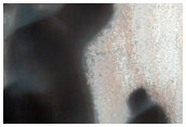 Dunes over Small Impact Crater in Olympia Undae
