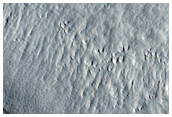 Crater with Impact Ejecta in Phlegra Dorsa Region
