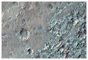 Spectrally Anomalous Crater Ejecta
