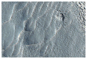 Dipping Layers in Crater within Moreux Crater
