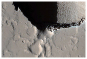 Pair of Collapse Pits in Ceraunius Fossae
