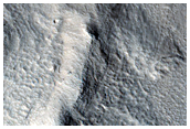 Layered Deposits in Craters Near Hrad Vallis
