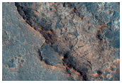 Layered Material Near Oxia Palus Candidate ExoMars Landing Site
