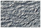 Lobate Deposit and Mesa Near Reull Vallis
