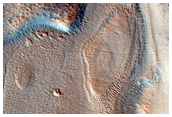 Dipping Layers in Crater in Northern Mid-Latitudes
