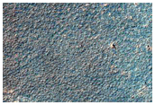 Light-Toned Bedrock Exposed in Valley Leading into Argyre Planitia
