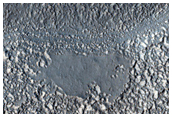 Channels Leaving Old Crater in Terra Cimmeria
