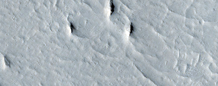 Curved Ridge-Trough Feature Near Zephyria Planum
