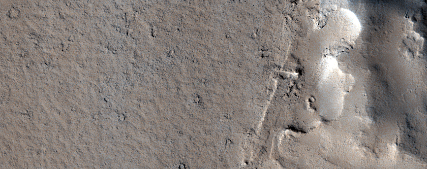Flow Features Overlapping Crater Ejecta Deposit

