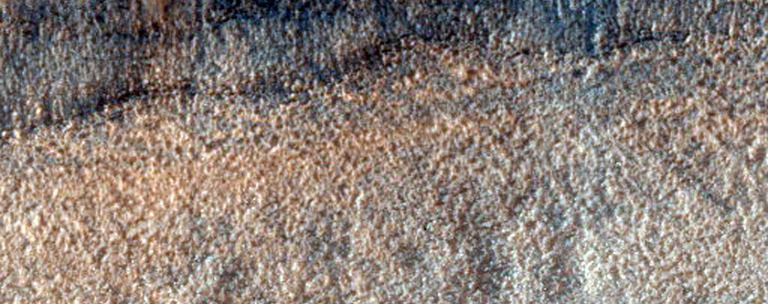 Channel Deposits on Hellas Planitia Rim to Floor Transition
