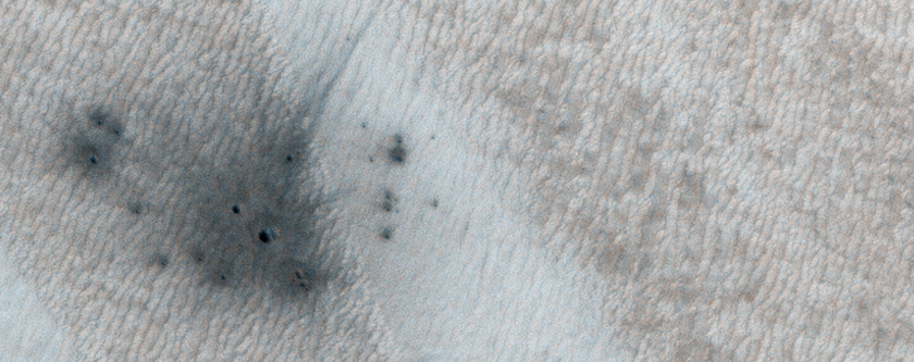 A New Crater on a Dusty Slope