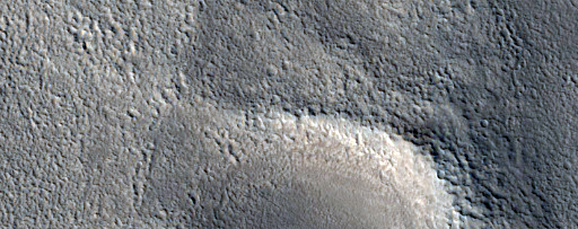 Channel along Ejecta from Northern Mid-Latitude Crater
