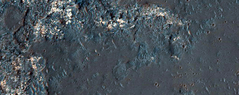 Light-Toned Surface with Parallel Ridges in Crater Interior
