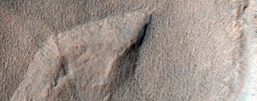 Small Crater in Aonia Terra
