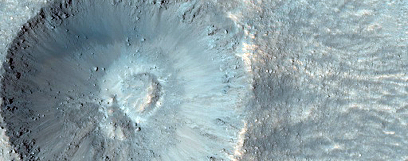 Small Crater with Possible Phyllosilicates in Ejecta
