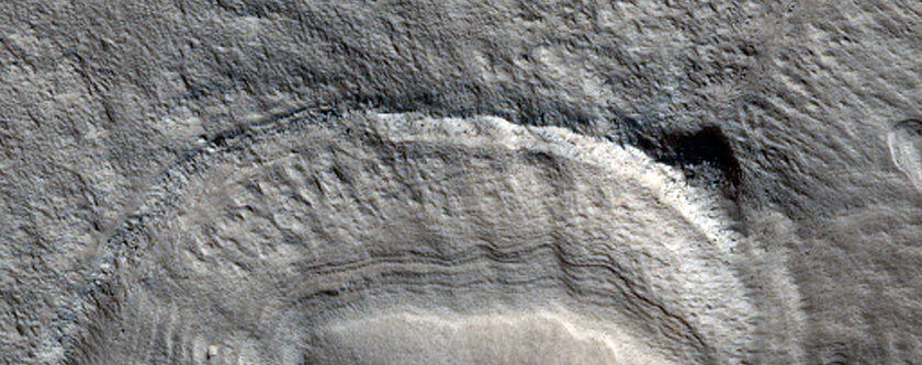 Raised and Banded Arcuate Feature in Tantalus Fossae Crater

