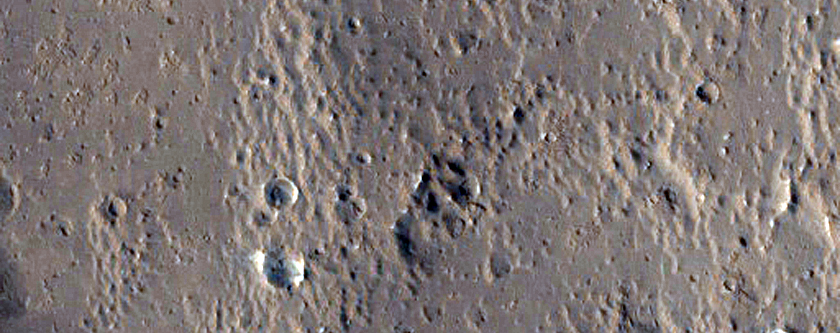 Layers Exposed on Rim of Crater in Lucus Planum
