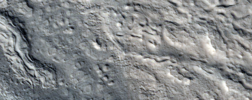 Lineated Valley Floor Material in the Coloe Fossae
