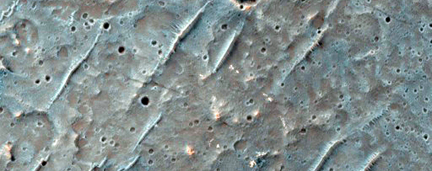 Possible Pitted Material on Crater Floor in Mare Tyrrhenum Region
