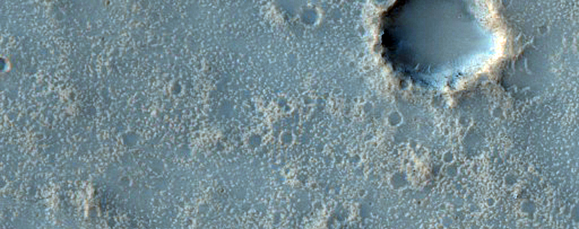 Light-Toned Material in Bakhuysen Crater Ejecta
