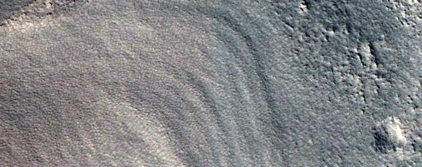 Arc-Shaped Ridges North of Moreux Crater
