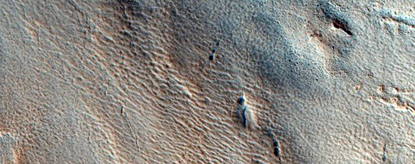 Pits Near Ridge and Trough Terrain in Protonilus Mensae
