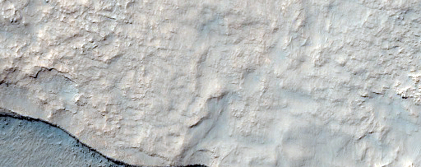 Possible Composition Diversity in Modified Crater Ejecta Deposit
