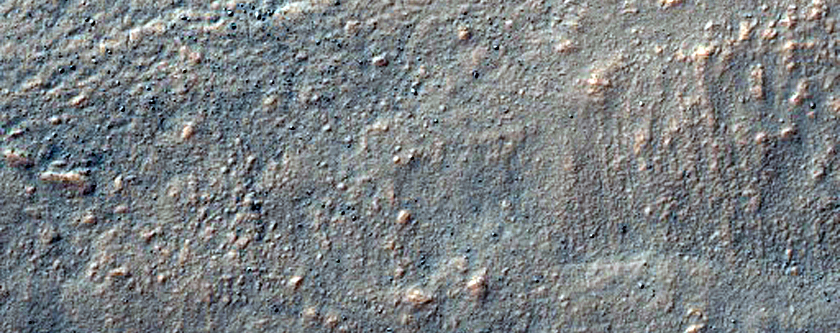 Flow Moving Out of Crater Northwest of Hellas Planitia
