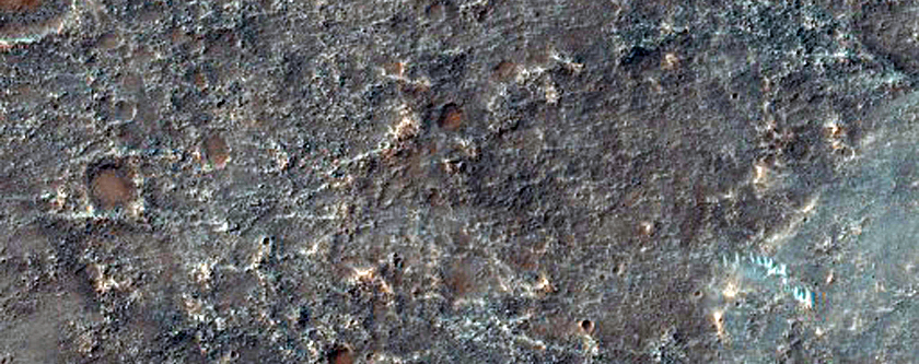Deposits and Landforms at Transition between Thaumasia and Solis Planum
