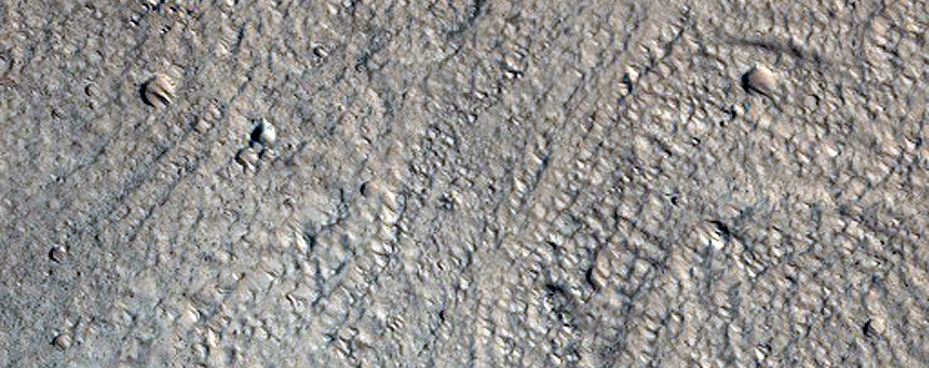 Crater with Concentric Crater Fill in Acheron Fossae Region
