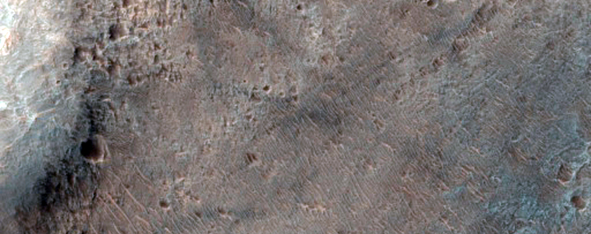 Light-Toned Deposits on Floor of Ladon Valles Basin
