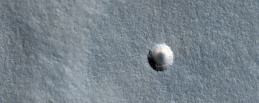 Mid-Latitude Crater with Black Spot in Middle
