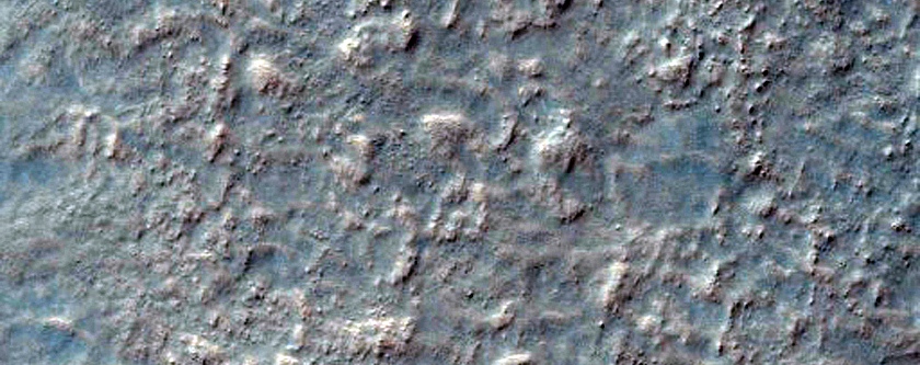 Central Pit of Impact Crater and Gullies on Equator-Facing Slope
