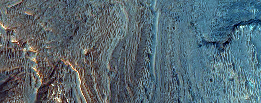 Layered Light-Toned Deposits on Floor of Orson Welles Crater

