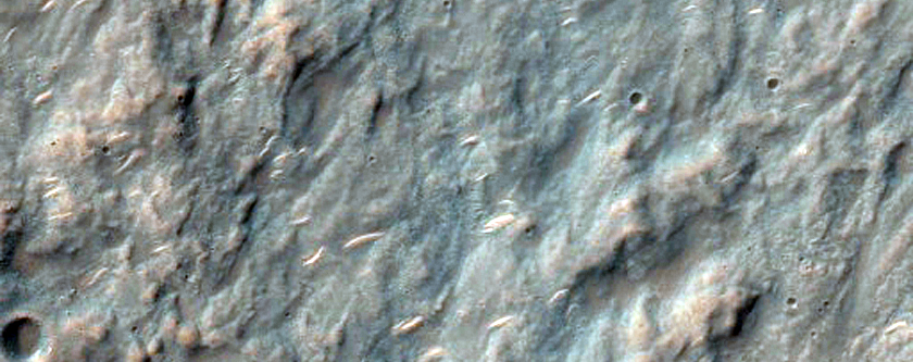 Exposed Breccia in Rim and Ejecta of Crater in Hesperia Planum

