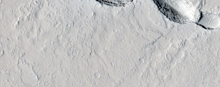Pits and Channels in Amazonis Planitia
