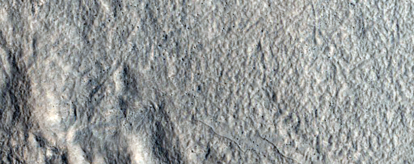 Dipping Layers in Degraded Crater in North Arabia Terra
