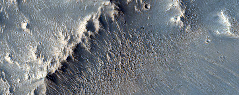 Pitted Material in Smaller Crater on Floor of Sharonov Crater

