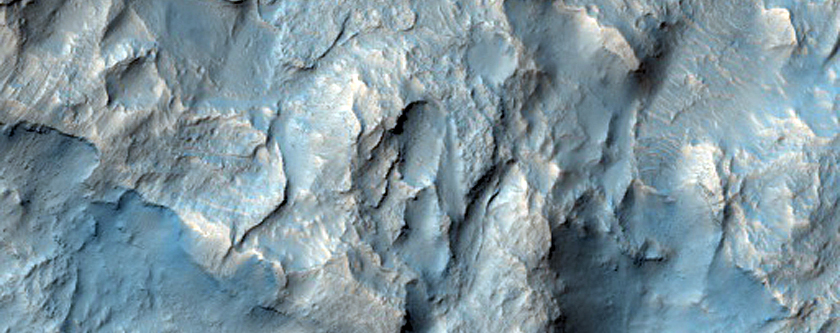 Eroded Layered Deposits on Floor of Orson Welles Crater