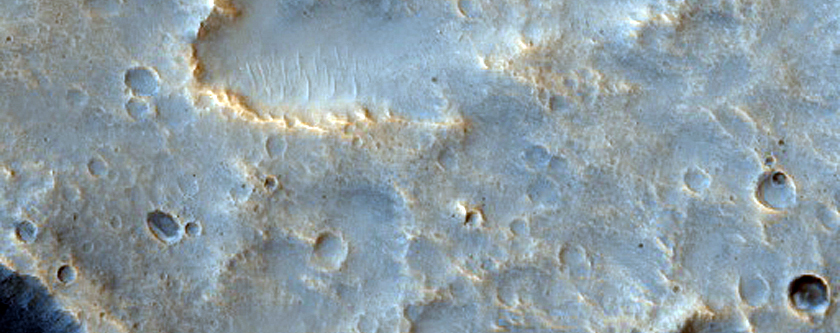 Ejecta and Secondaries of Well-Preserved Crater in Nilokeras Mensae
