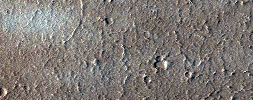 Crater with Inlet and Outlet Channels in Northern Mid-Latitudes

