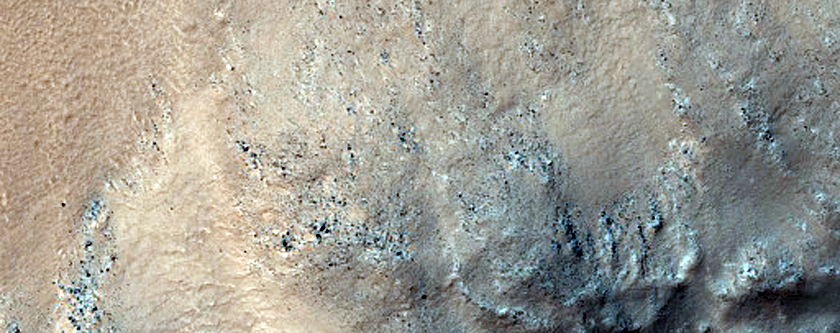 Flow Over Crater Rim in Far Eastern Daedalia Planum
