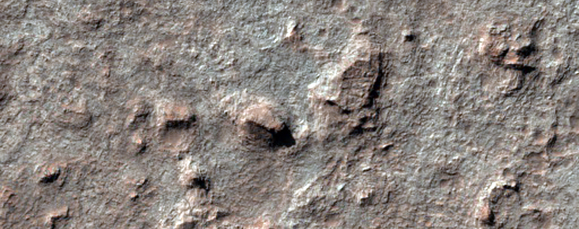 Intracrater Buttes and Mesas and Banding

