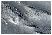 Channels along Degraded Crater in Arabia Terra
