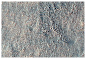 Curved Ridges Meeting Dark Plain
